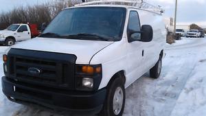  Ford Cargo Van with shelving and roof rack